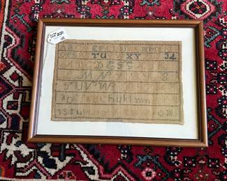 U24 - $125. Antique Cross Stitch Sampler on Burlap. Measures 16" wide x 12" tall.