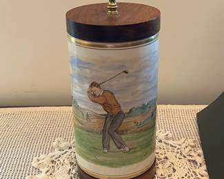 F53- $575. Frank Vosmanski Hand Painted Golfer Lamp. Base is 5.25 d x 20.5" tall.