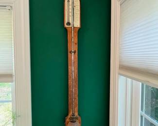 S41 - $450. Antique English Stick Barometer & Thermometer. Negretti & Zambia. Measures 4.5" wide x 36" tall. The top is either bone or Celluloid and reads "Chadburn Bros. Opticians Sheffield"