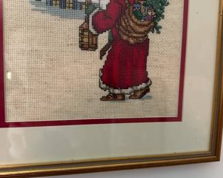 U35 - $20. Santa Cross Stitch. Measures 12" wide x 13.5" tall.