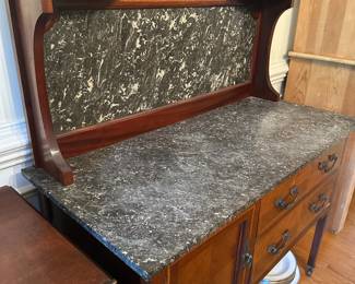 D56 - $400. Edwardian Mahogany Marble Top Washstand. Measures 42" wide x 19" deep x 49" tall. Drawers slide - door opens. Overall excellent condition!