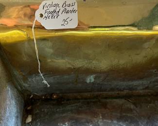 S23- $25. Brass Footed Planter. Measures 14" wide x 8" deep x 8" tall.