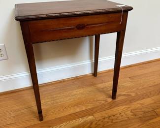 L49 - $175. Small Antique Side Table with Drawer. Measures 24" wide x 15" deep x 27.5" tall. Tag inside reads "Inlaid Stand with drawer, Circa 1795, of American Red Cherry found near Carthage, NC. Secondary wood is yellow poplar. The stylized spears and diamond inlays would indicate the work of a regional cabinet maker." Measures 24" wide x 15" deep x 27.5" tall.