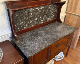 D56 - $400. Edwardian Mahogany Marble Top Washstand. Measures 42" wide x 19" deep x 49" tall. Drawers slide - door opens. Overall excellent condition!