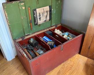L10 - $150. Wooden Trunk with Tools. Measures 31.5" wide x 17.5" deep x 13.25" tall.