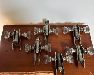 L68 - $200. Set of 12 doorknobs (6 with double handles & 6 single handles with locks). Names read Dexter & National Brass Co.