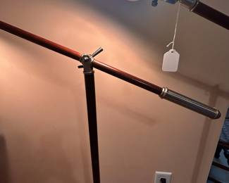 B19 - $55 Each. 2 Available. Wooden and Metal Folding Floor Lamp - adjustable. Measures 34" wide and adjusts heights. (39" tall from floor to the handle)