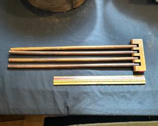 L22 - $25. Primitive 4 Arm Clothes Drying Rack. Measures 17.5" wide x 5" tall. Wall Mounts.
