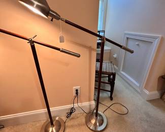 B19 - $55 Each. 2 Available. Wooden and Metal Folding Floor Lamp - adjustable. Measures 34" wide and adjusts heights. (39" tall from floor to the handle)