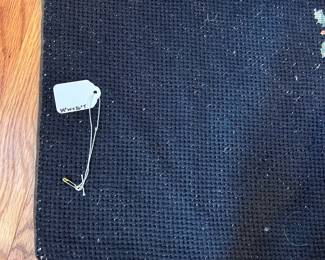 F39- $65. Eagle Needlepoint Rug. Measures 57" wide x 26" tall.