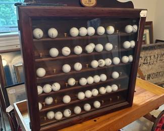 U72 - $40. Golf Ball Display Case. Measures 25.5" wide x 4" deep x 27.5" tall.