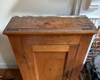 L33 - $250. Antique Wall Cabinet. Measures 24.5" wide x 9.25" deep x 42" tall. Very good condition. (Has a bit of paint on the top from wherever it was pulled out of.)