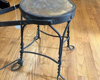S43 - $60. Shoe Shine Stool. Wooden seat with wrought iron frame. Measures 24" long x 9.5" wide x 19.25" tall.