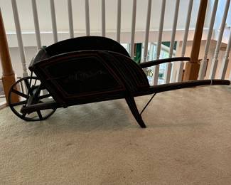 H6 - $125. Primitive Childs Wheelbarrow with removable sides. Metal Wheel. Measures 17.75" wide x 46 .25" deep x 17.25" tall