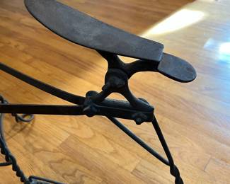 S43 - $60. Shoe Shine Stool. Wooden seat with wrought iron frame. Measures 24" long x 9.5" wide x 19.25" tall.