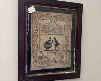 U34 - $40. Framed Antique Sampler. Measures 17" wide x 20.5" tall. Frame has paint chipping.