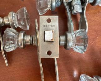 L68 - $200. Set of 12 doorknobs (6 with double handles & 6 single handles with locks). Names read Dexter & National Brass Co.