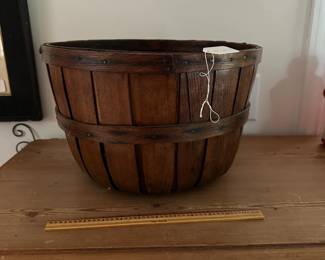 F33- $75. Wooden Apple Swing Basket. Measures 15" round x 9" tall. Carved initials "ER" on the bottom.