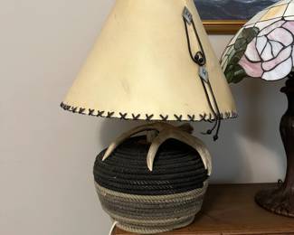 C27 - $50. Antler Lamp with Leather Shade. Measures 16" wide x 23" tall.