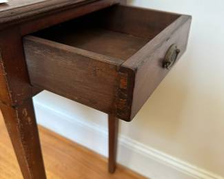 L49 - $175. Small Antique Side Table with Drawer. Measures 24" wide x 15" deep x 27.5" tall. Tag inside reads "Inlaid Stand with drawer, Circa 1795, of American Red Cherry found near Carthage, NC. Secondary wood is yellow poplar. The stylized spears and diamond inlays would indicate the work of a regional cabinet maker." Measures 24" wide x 15" deep x 27.5" tall.