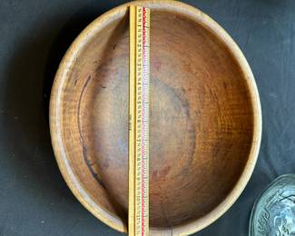 L39 - $150. Antique Dough Bowl - original Blue Paint. Slightly out of round. Measures 13.25" wide x 12.25" deep x 4" tall. One hairline crack on edge.