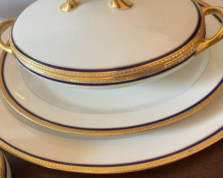 D32- $200. Limoges Dinner Set (9 pieces) Cobalt and Gold - includes 1 soup tureen, 1 cream+ sugar bowl, 1 serving platter (17.5" wide), 1 lidded serving dish, and 1 small platter (14" wide).