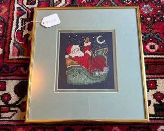 U37 - $25. Santa Cross Stitch. Measures 11" wide x 11.75" tall.