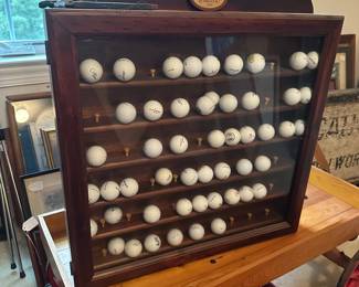 U72 - $40. Golf Ball Display Case. Measures 25.5" wide x 4" deep x 27.5" tall.