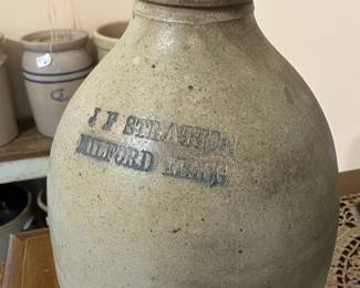 B22 - $50. J F Stratton Milford Mass Pottery Jug with handle. Measures 6" wide x 9" tall.