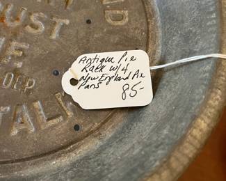 D43- $85. Antique Pie Rack 4 New England Pie Pans. Measures 11" wide x 10.5" tall.