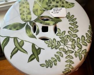 D44- $60. Botanical Ceramic Garden Stool. Measures 11" wide x 18" tall.