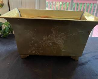 S23- $25. Brass Footed Planter. Measures 14" wide x 8" deep x 8" tall.