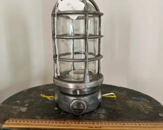 F6 - $25. Vintage Killark VAG-100 Explosion Proof Lighting Fixture Cage. Measures 10" tall.