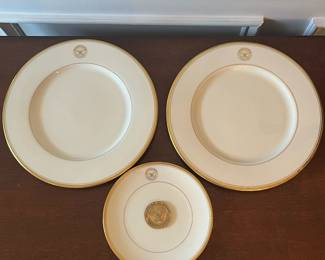 D36- $100. Department of Defense Plates. Set of 2 large (10.75") and 1 small (7.25") with coin (attached but appears to be a Rumsfeld Coin)