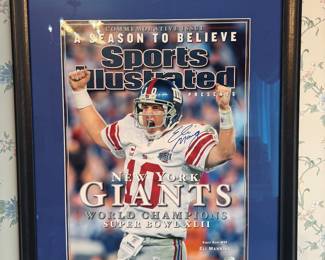 Framed Sports Illustrated Cover Photograph World Champions Super Bowl XLII Autographed by Eli Manning (Steiner Sticker COA)