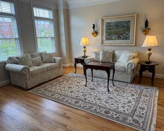 Home Elements Floral Motif Upholstered Cream Tone Loveseat (62"W x 35"D x 29-1/2"H / 2 Available) with Queen Anne Style Mahogany Tea Table (18"W x 28"D x 25"H) & Queen Anne Style 1 Drawer Side Table (27"D x 18"W x 23"H) with Stiffel Porcelain Body Table Lamp (2 Available) & Queen Anne Round Mahogany 1 Drawer Side Table (25"D x 21"W x 23"H) with Stiffel Porcelain Body Table Lamp (2 Available) with Framed Original Serigraph "Sunrise and Morning Glories" Autographed by John Powell / Edition 161/300 accented with Hand-Knotted Kashan Wool Pile Rug (71"W x 108"L)