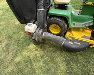 John Deere Lawn Tractor with Honda-Powered Bagger Vacuum
John Deere riding mower with large rear bagger, Honda engine-powered vacuum, and heavy-duty collection system. Ideal for efficient grass and leaf pickup. Hampshire IL estate sale.