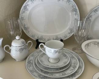 Noritake China. Service for 6 with extra pieces. Accessory pieces are available as well including sugar/creamer, serving bowls and more. Crystal stemware.