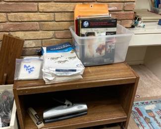 Misc office supplies - legal paper, photo paper, envelopes, 3 hole punch, stapler, misc, printer cabinet (as is)