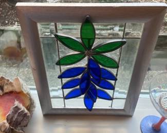 Beautiful Stained Glass artwork. There are several 'cracks' in the glass pieces and glass is broken on backside.