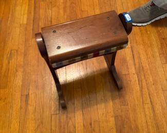 Wooden side of rocking foot stool