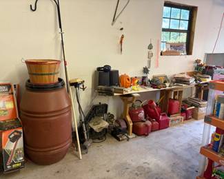 Rain barrel, gas cans, vintage magazines