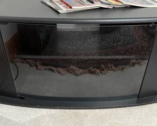 Black TV stand with glass door