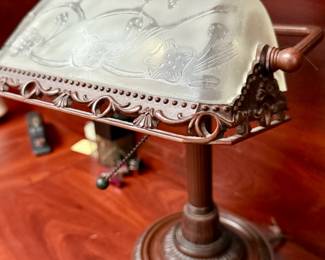 Copper tone banker's lamp with frosted glass shade