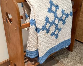 Country style quilt rack with hand-stitched twin quilt