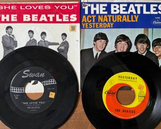 The Beatles singles "She Loves You" and "Yesterday" with original sleeves
