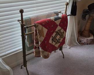 Quilts and quilt rack.