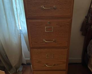 Full size wooden filing cabinet.