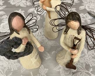 Several Willow Tree angel figurines