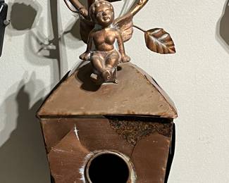 Copper birdhouse on stand